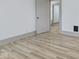 Bright bedroom featuring a open doorway with light-colored floors and white walls at 218 W 31St St, Indianapolis, IN 46208