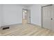 Clean, light-filled room showcasing an open doorway that leads to another room at 218 W 31St St, Indianapolis, IN 46208