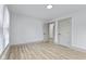 Bright bedroom featuring a view into the hallway with light-colored floors and white walls at 218 W 31St St, Indianapolis, IN 46208