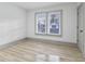 Bright bedroom featuring two large windows with natural light and view of the neighborhood at 218 W 31St St, Indianapolis, IN 46208