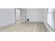 Clean bedroom with light-colored floors and fresh white walls, leading to an open doorway at 218 W 31St St, Indianapolis, IN 46208