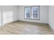 Bright bedroom featuring a window that offers a view of the neighborhood at 218 W 31St St, Indianapolis, IN 46208