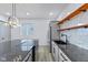 Modern kitchen with large island, stainless steel appliances, and open shelving at 218 W 31St St, Indianapolis, IN 46208