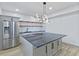 Contemporary kitchen featuring stainless steel appliances and a central island at 218 W 31St St, Indianapolis, IN 46208
