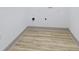 Utility room features modern flooring with washer and dryer hookups and an electrical outlet at 218 W 31St St, Indianapolis, IN 46208