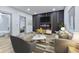 Modern living room features stylish decor, sleek furniture, and an open doorway to the bathroom and bedroom at 218 W 31St St, Indianapolis, IN 46208