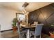 Inviting dining room features a round table, four chairs, modern lighting, and stylish decor at 362 1400 N, Summitville, IN 46070