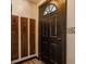 Entryway features a dark door with sidelight, unique wall decor, and durable flooring at 362 1400 N, Summitville, IN 46070