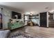 Cozy living area featuring a large TV, eye-catching green storage unit and modern decor at 362 1400 N, Summitville, IN 46070