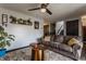 Cozy living room with a comfortable sofa, decorative rug, and a ceiling fan for added comfort at 362 1400 N, Summitville, IN 46070