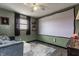 Relaxing living room with a comfortable sofa and a large projection screen for movies at 362 1400 N, Summitville, IN 46070