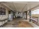 Enclosed patio featuring comfortable seating and an open view of the yard at 362 1400 N, Summitville, IN 46070
