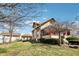 A detached garage, lush lawn, and blue skies make the backyard a serene retreat at 403 S Ohio St, Sheridan, IN 46069