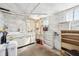 Utility basement featuring a laundry sink, shelving, and painted walls presents renovation potential at 403 S Ohio St, Sheridan, IN 46069