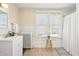 Bathroom featuring vintage radiator, neutral paint, sink with vanity, and shower curtain for privacy at 403 S Ohio St, Sheridan, IN 46069