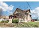 Charming home featuring red trim, a covered porch, and mature landscaping at 403 S Ohio St, Sheridan, IN 46069