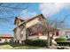 Side view of an attractive home with red trim, a quaint porch, and a well-manicured lawn at 403 S Ohio St, Sheridan, IN 46069