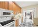 Eat-in kitchen featuring wooden cabinets, and modern appliances at 403 S Ohio St, Sheridan, IN 46069