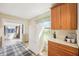 Eat-in kitchen featuring wooden cabinets, and modern white refrigerator at 403 S Ohio St, Sheridan, IN 46069