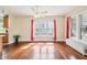 Spacious living area featuring hardwood floors, lots of natural light, and neutral paint at 403 S Ohio St, Sheridan, IN 46069