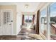 Bright sunroom with wood floors, large windows, and sliding glass doors to outdoor deck at 403 S Ohio St, Sheridan, IN 46069