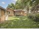 Well-maintained backyard with green grass and partial house view at 4220 Sunset Ave, Indianapolis, IN 46208