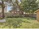 Fenced backyard with grass and trees at 4220 Sunset Ave, Indianapolis, IN 46208