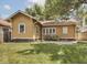 Backyard view with grass area and exterior view of the house at 4220 Sunset Ave, Indianapolis, IN 46208