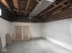 Clean, unfinished basement with painted walls and exposed brick detail at 4220 Sunset Ave, Indianapolis, IN 46208