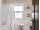 Cozy bathroom with tub and shower combination and neutral color palette at 4220 Sunset Ave, Indianapolis, IN 46208