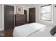 Bright bedroom with hardwood floors, a window, and a dresser for ample storage at 4220 Sunset Ave, Indianapolis, IN 46208