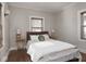 Inviting bedroom with a comfortable bed, warm lighting, and natural wood floors at 4220 Sunset Ave, Indianapolis, IN 46208