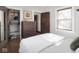 This well-organized bedroom features hardwood floors, a built-in closet, and ample natural light at 4220 Sunset Ave, Indianapolis, IN 46208