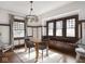 Bright dining area with natural light, built-in bench seating and hardwood floors at 4220 Sunset Ave, Indianapolis, IN 46208