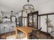 Open concept dining room flows into the updated kitchen with white cabinets and stainless appliances at 4220 Sunset Ave, Indianapolis, IN 46208