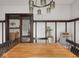 Elegant dining area featuring a wood table, decorative lighting, and view to living area at 4220 Sunset Ave, Indianapolis, IN 46208