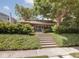 Charming home with landscaped front yard, mature tree, and welcoming front steps at 4220 Sunset Ave, Indianapolis, IN 46208