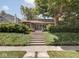 Charming home with landscaped front yard, mature tree, and welcoming front steps at 4220 Sunset Ave, Indianapolis, IN 46208