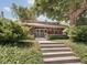 Charming home with landscaped front yard, mature tree, and welcoming front steps at 4220 Sunset Ave, Indianapolis, IN 46208