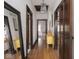 Long hallway featuring hardwood floors and dark wood trim throughout at 4220 Sunset Ave, Indianapolis, IN 46208