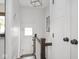 Bright hallway with white walls and a door leading to the exterior at 4220 Sunset Ave, Indianapolis, IN 46208