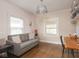 Comfortable living room with hardwood floors, a gray sofa, and natural light at 4220 Sunset Ave, Indianapolis, IN 46208