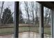 View from sliding glass doors to wooden back deck and large backyard at 5746 Overcrest Dr, Indianapolis, IN 46237