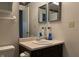 Cozy bathroom featuring a vanity with sink and framed mirrors at 5746 Overcrest Dr, Indianapolis, IN 46237