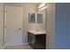 Bathroom with carpet, vanity, and framed mirrors at 5746 Overcrest Dr, Indianapolis, IN 46237