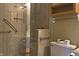 Bathroom showcasing a glass-door shower with tiled walls and vanity at 5746 Overcrest Dr, Indianapolis, IN 46237