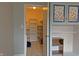 Walk-in closet with white shelving and carpeted floors at 5746 Overcrest Dr, Indianapolis, IN 46237