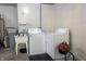 Functional laundry area with washer, dryer, and utility sink at 5746 Overcrest Dr, Indianapolis, IN 46237