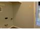 Bright laundry room with beige walls, linoleum floors and utility hookups at 5746 Overcrest Dr, Indianapolis, IN 46237
