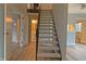 Carpeted staircase with adjacent bathroom, doorway, and clear view to the home's upper level at 5746 Overcrest Dr, Indianapolis, IN 46237